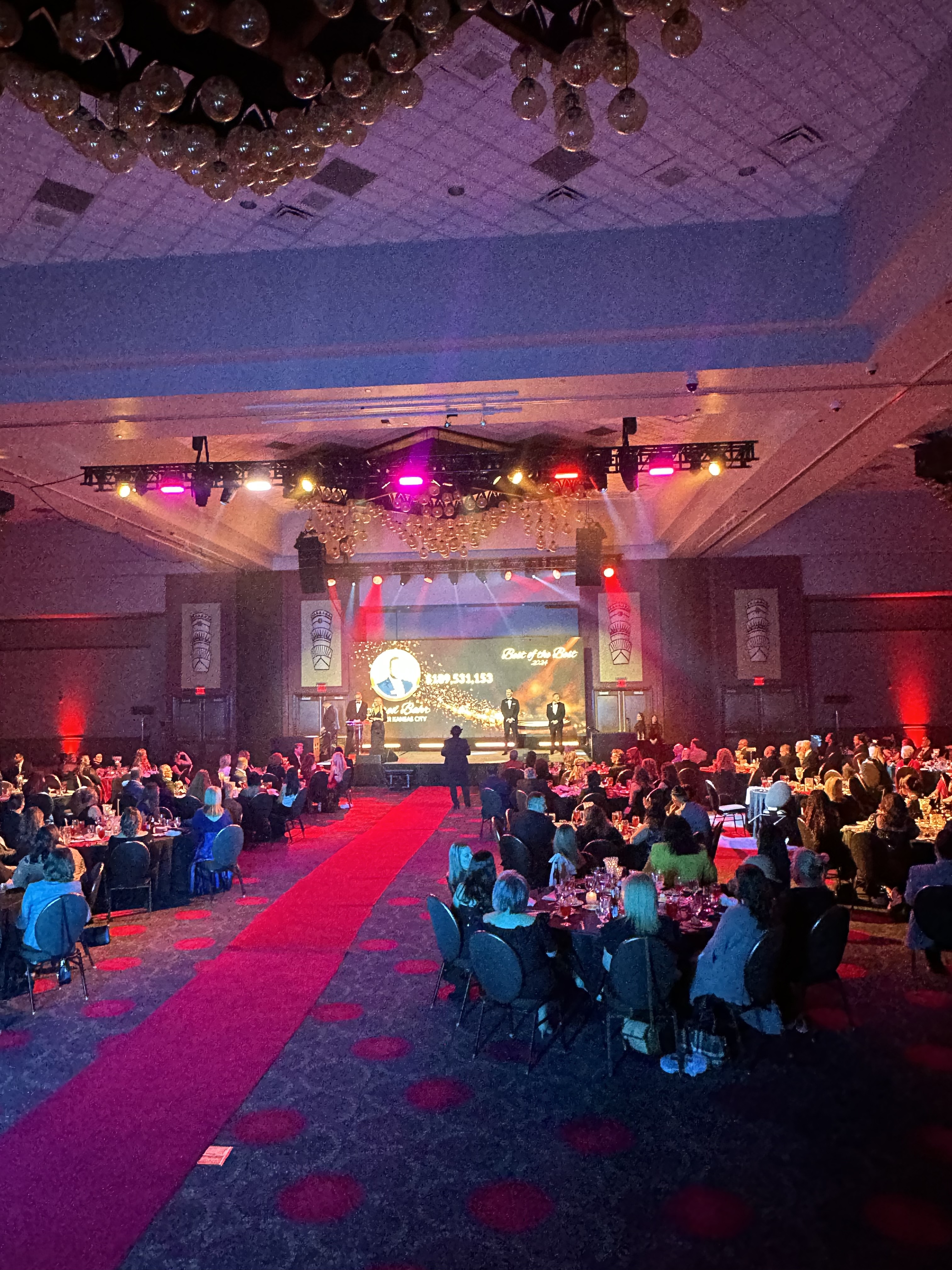 Gala with full stage production and red uplighting